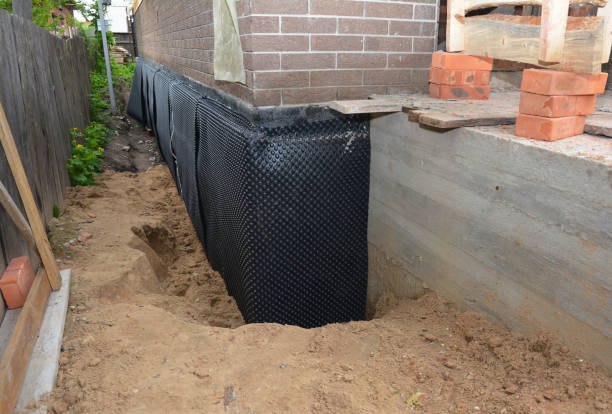 SJ Waterproofing Pros technician performing targeted Waterproofing assessment in East Chicago, IN